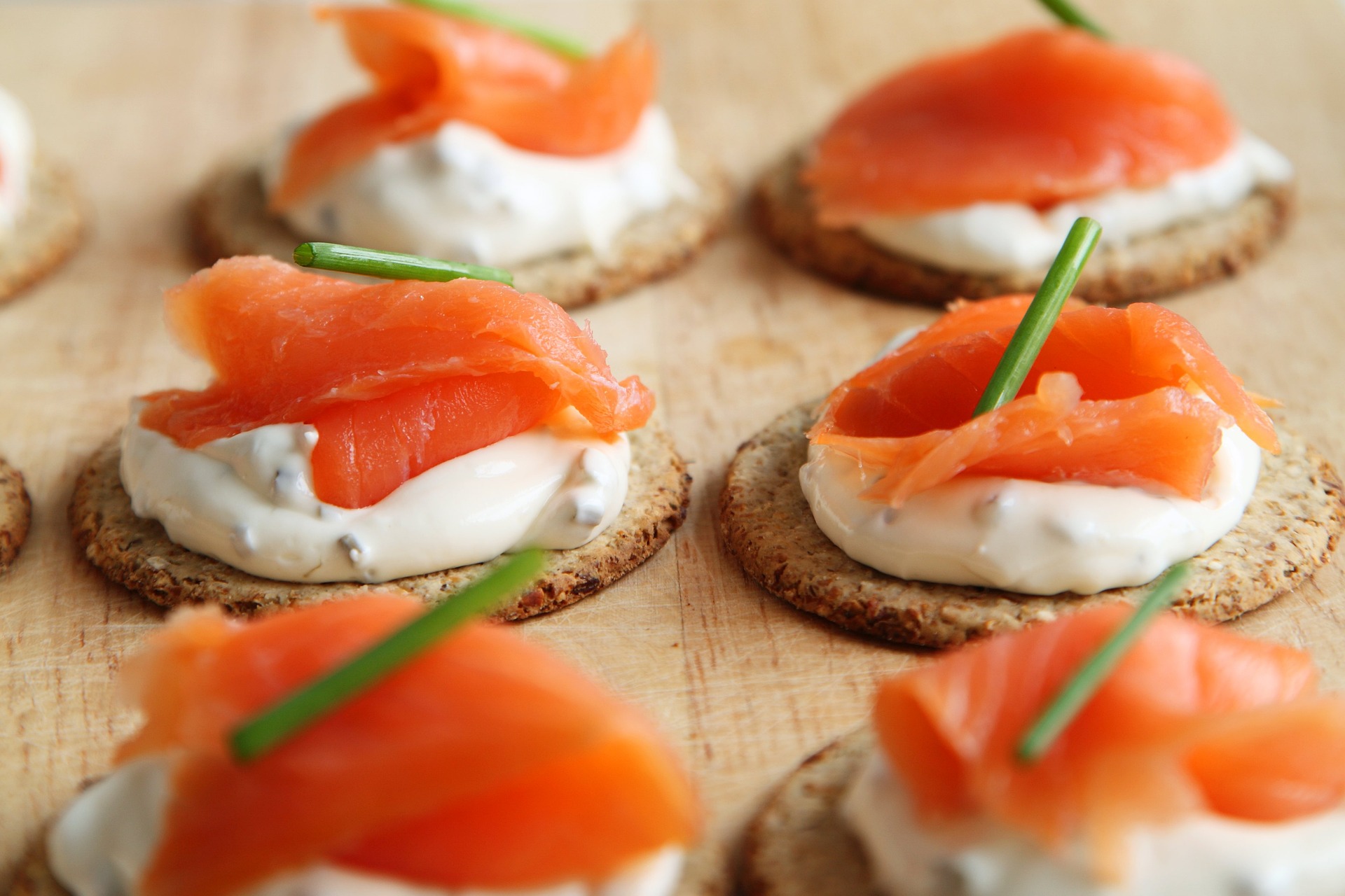 Salmon with cream cheese on crackers; salmon is a fish which can cause an allergic reaction.  Our no win no fee solicitors are here to assist with your allergy compensation claim.