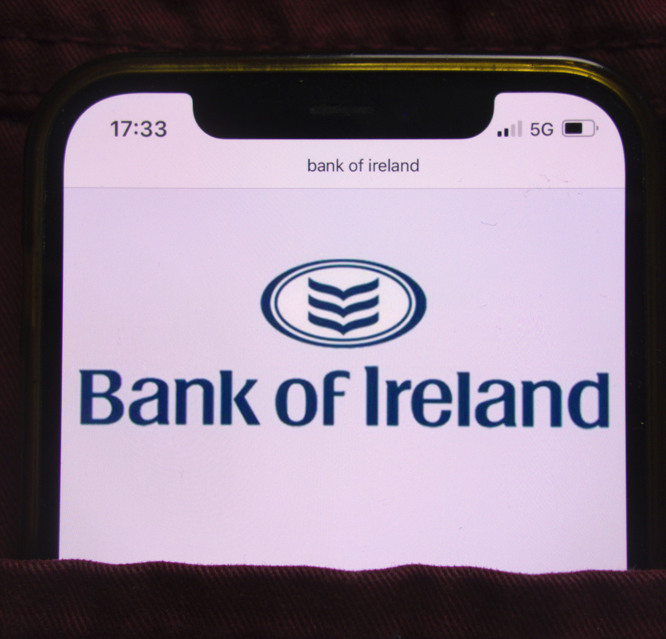 Bank of Ireland's logo on a phone screen; our Conveyancing Solicitors can help with your Bank of ireland mortgage for your property purchase, as solicitors on Bank of ireland's lender panel.