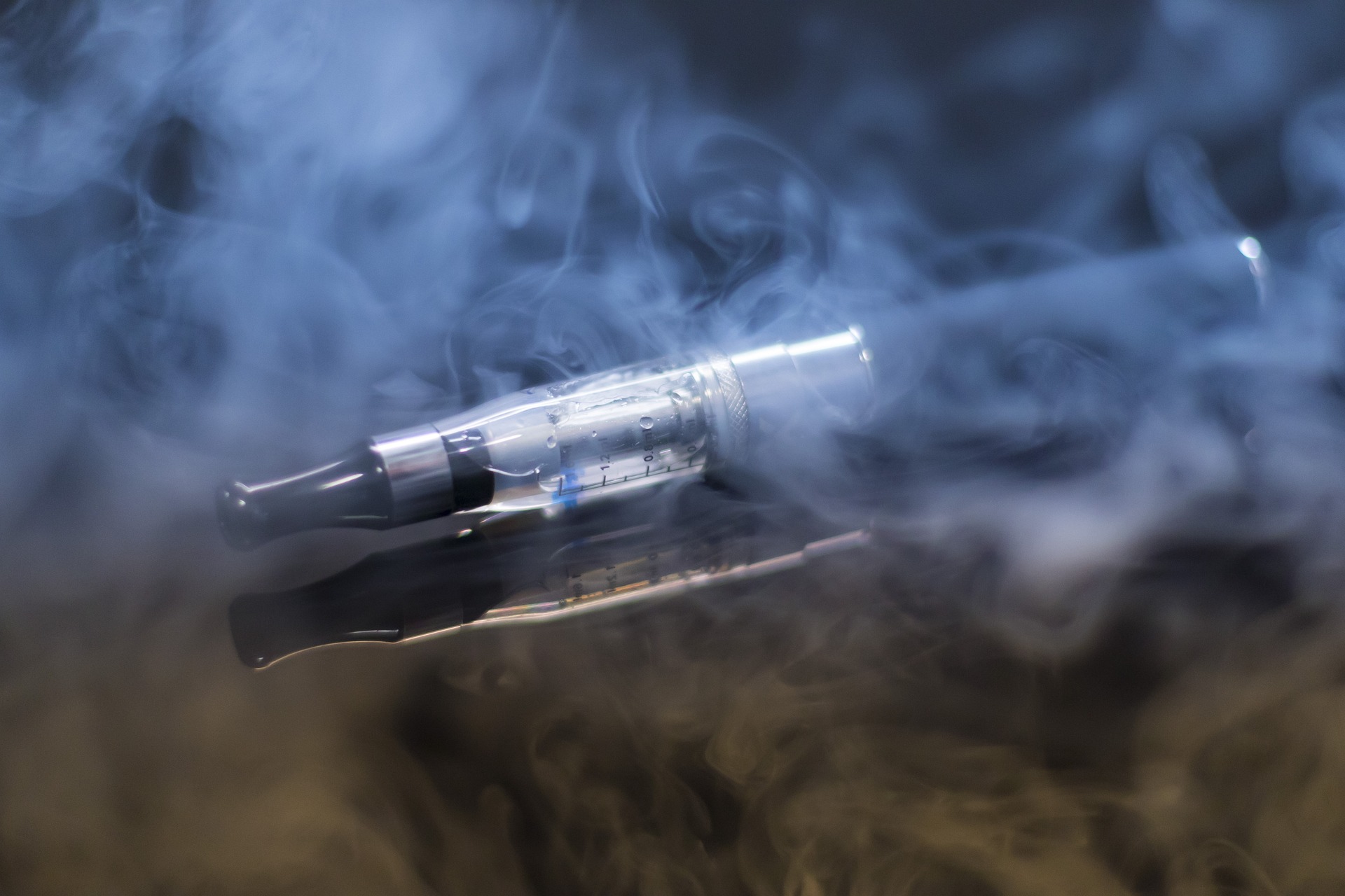 An e-cigarette with vapour blowing out.  Click the picture, or the link below, to go to our personal injury solicitors’ no win no fee faulty product claims page.