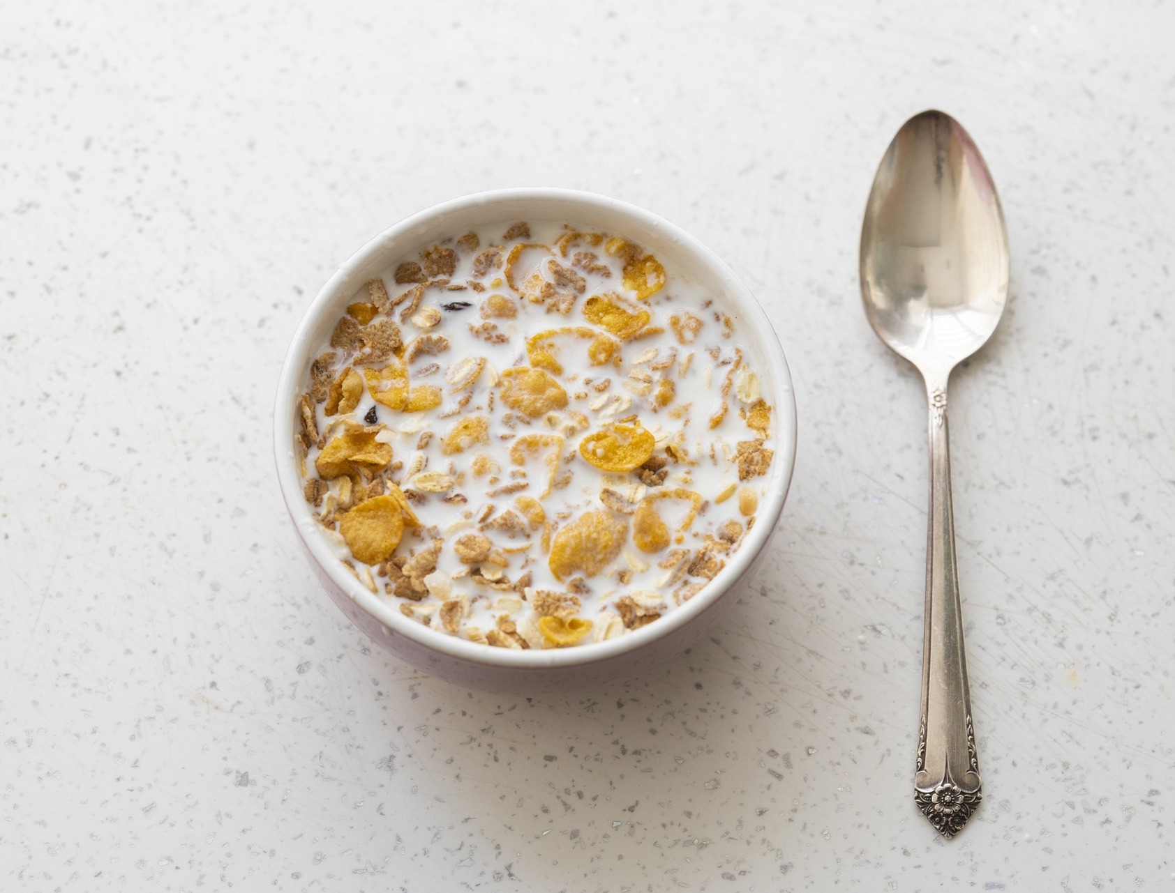 A bowl of cereal with a spoon.  Our no win no fee solicitors can assist with a gluten allergy compensation claim due to undisclosed gluten in cereal.