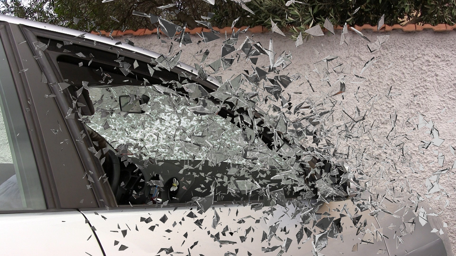 A car window, with glass smashed; our No Win No Fee Solicitors can assist with your injury compensation claim if you have been been involved in a serious Road Traffic Accident.