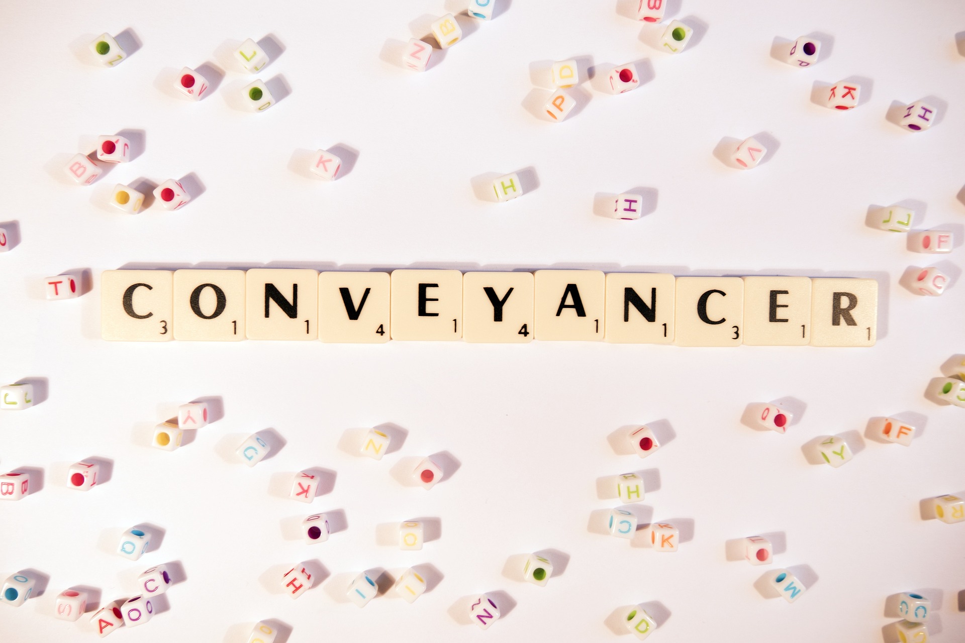 "Conveyancer" in scrabble tiles; our