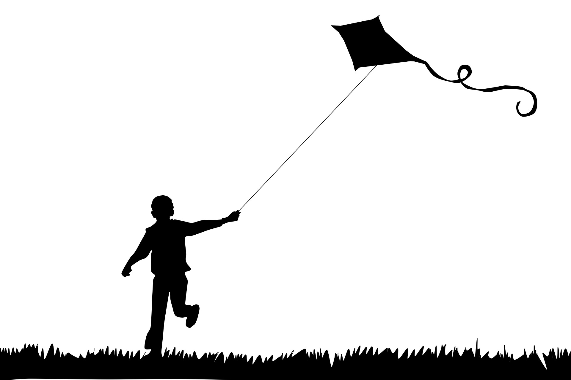 The shilouette of a child running through a field, holding a kite; our Wills Solicitors in Lancaster discuss guardianship in Wills and why it is important.