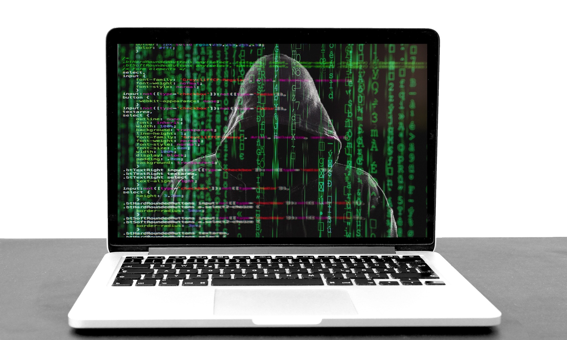 A Laptop with the screen on, showing code in green and red and white text, with the silhouette of a person with their hood covering their face behind the text; our Conveyancing Solicitors in Lancaster discuss Conveyancing fraud, and how we take steps to prevent it.