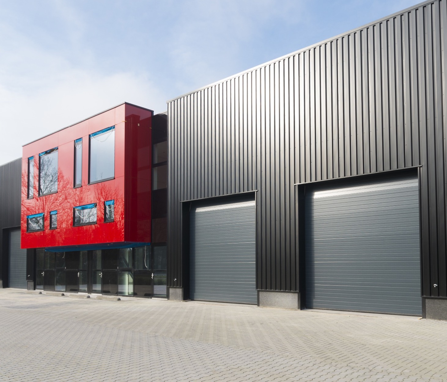 A commercial building, with red frontage; our commercial conveyancing solicitors can help with your commercial property sale.