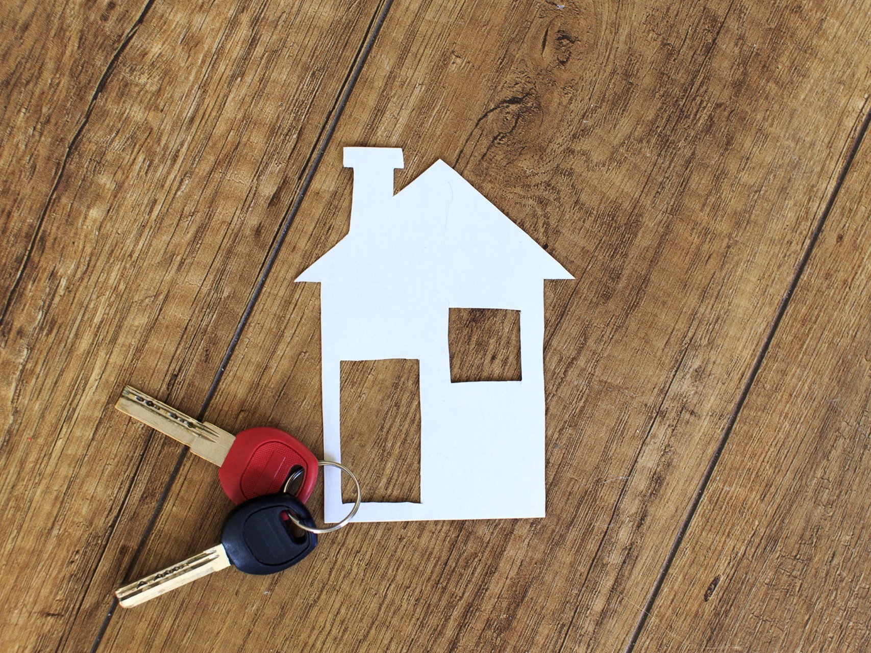 A paper house, with a set of keys on top; our Wills Solicitors in Lytham discuss whether you need a Will if you own property.
