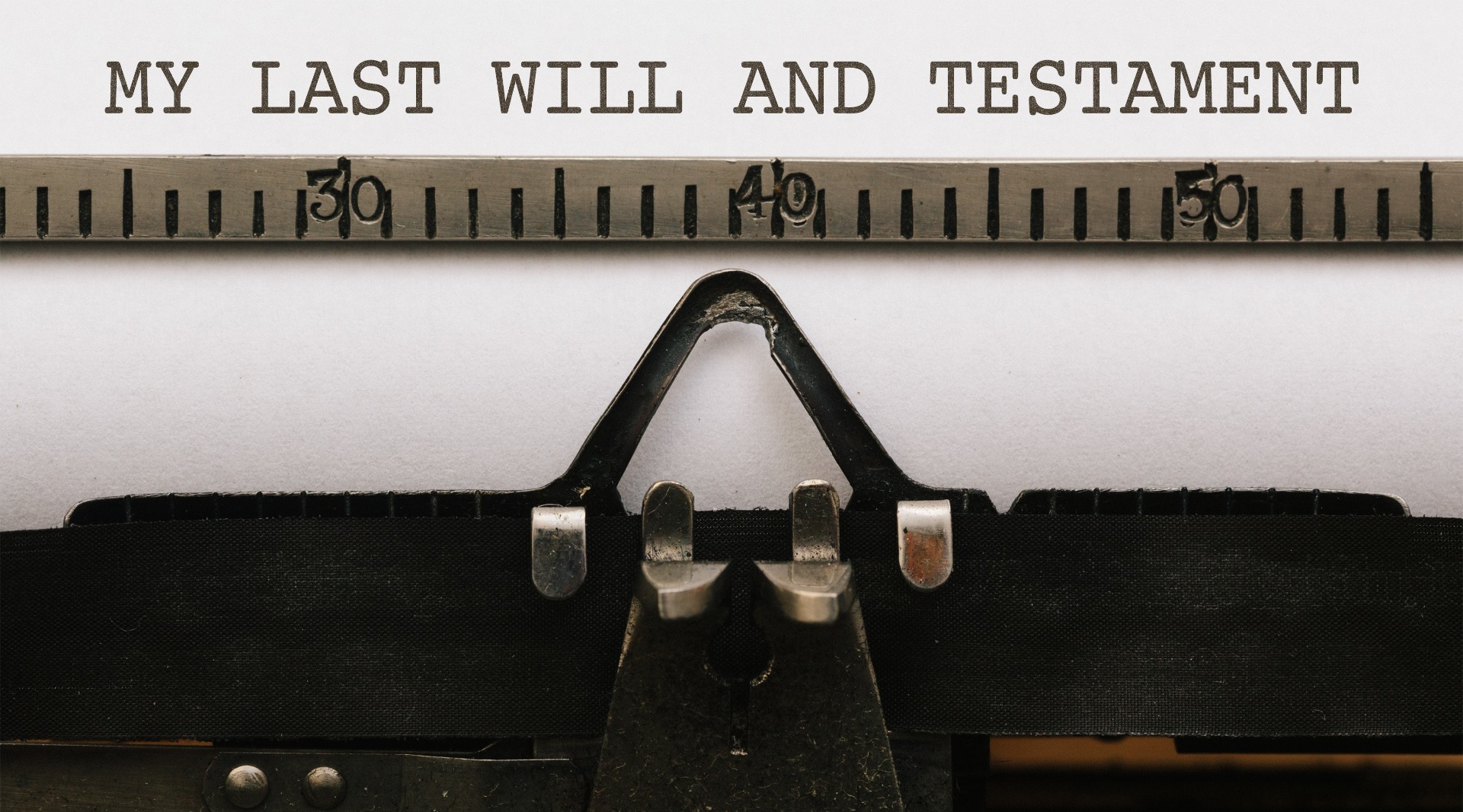 'My Last Will and Testament' written on a type-writer machine.