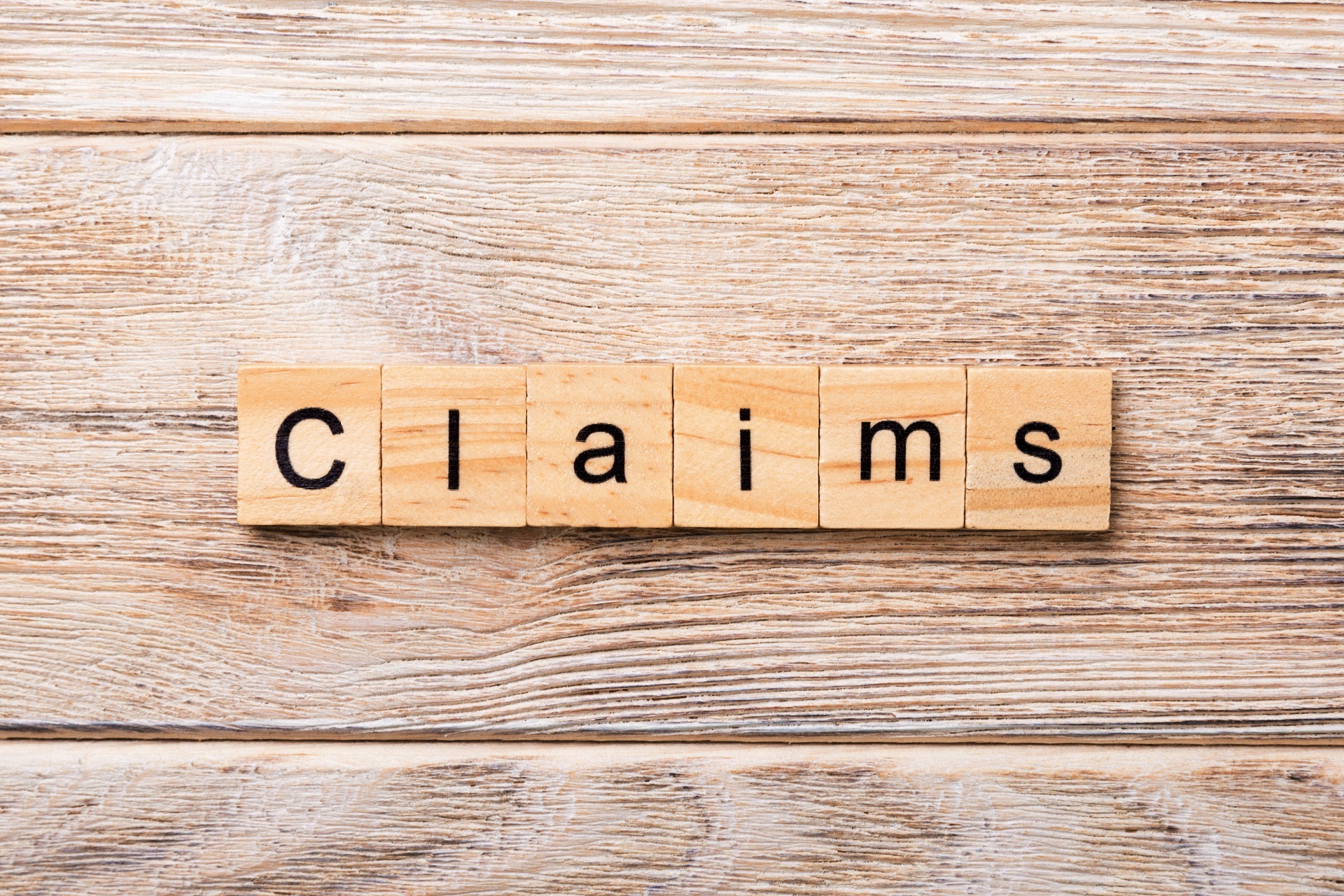 "Claims" in scrabble letters; our No Win No Fee Personal Injury Solicitors discuss making a Personal Injury claim and how we can help.