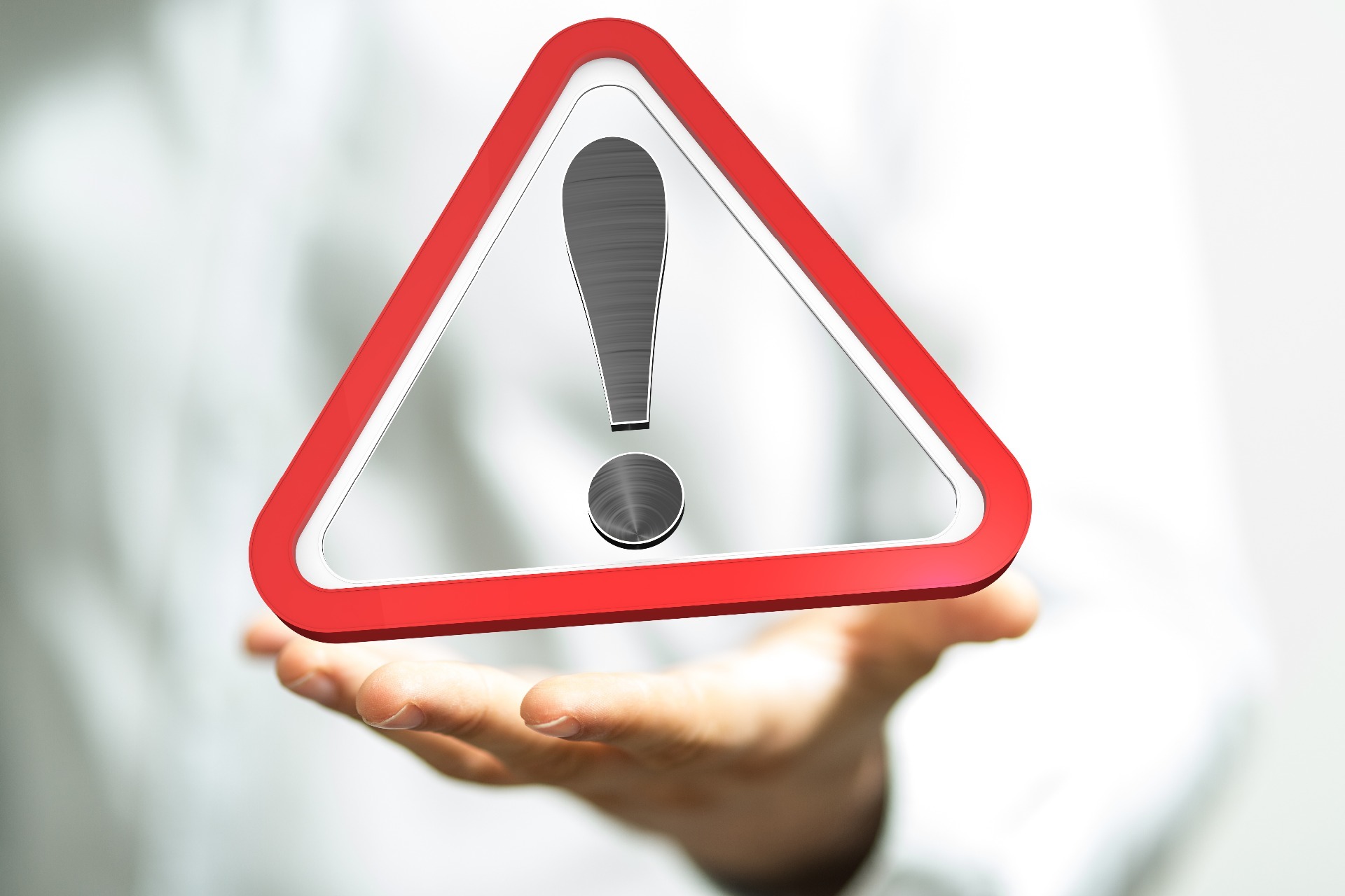 An exclamation mark in a red triangle, warning.  Our Conveyancing Solicitors in Lytham discuss the necessity of Gas Safety checks.