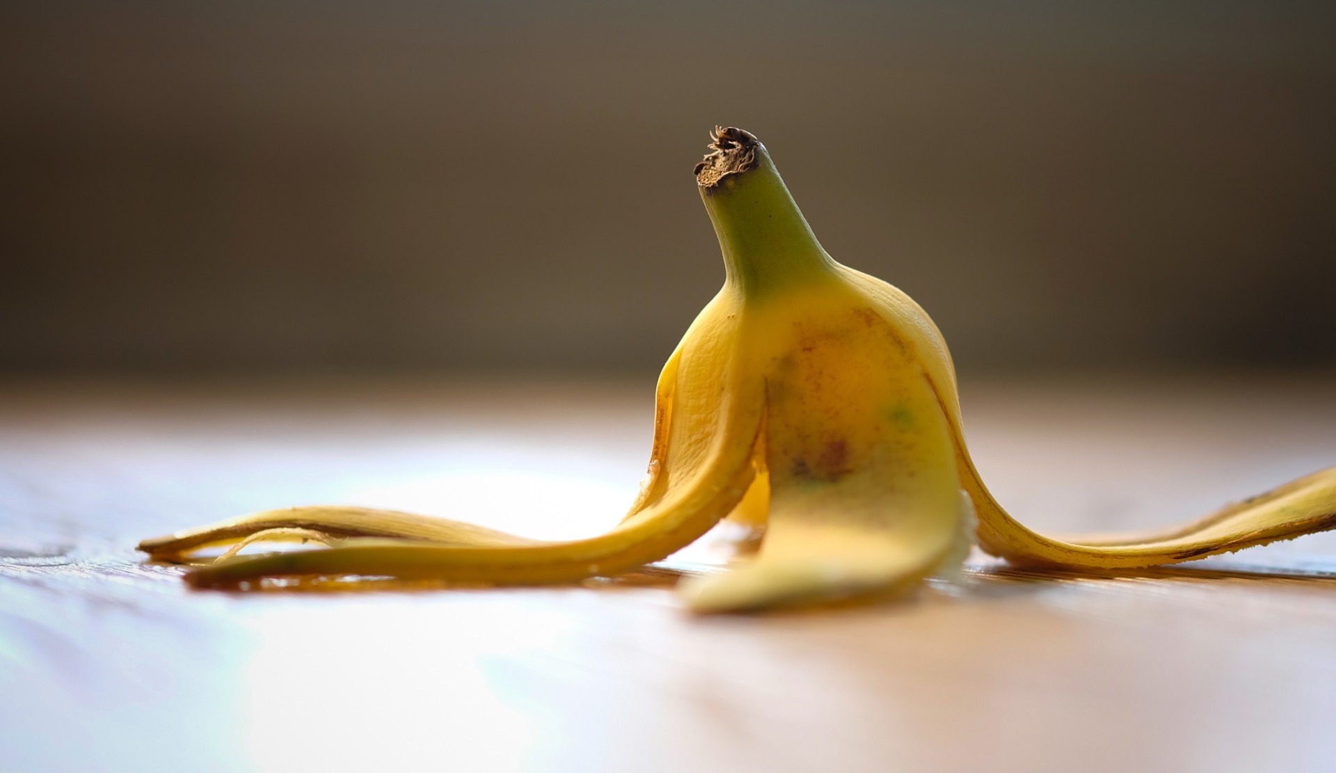 A banana peel which has been left on the floor as an obstruction.